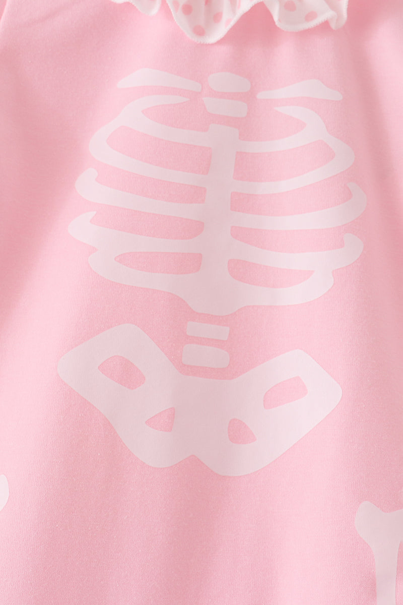 Pink skeleton print ruffle romper